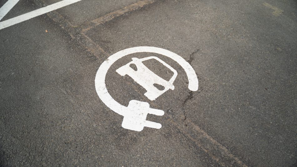 Electric vehicle charging bay road marking
