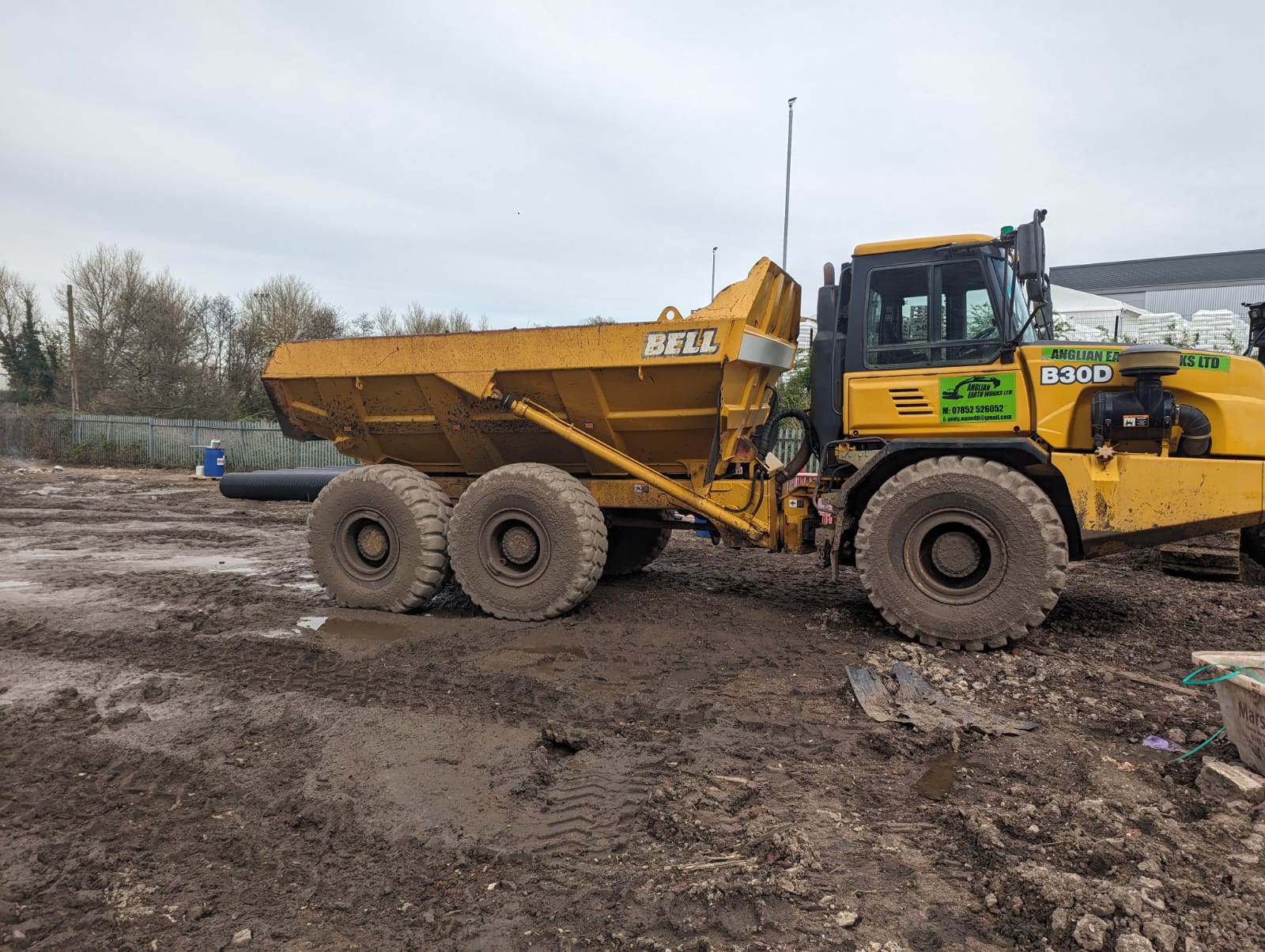 Large yellow articulated dump truck on site