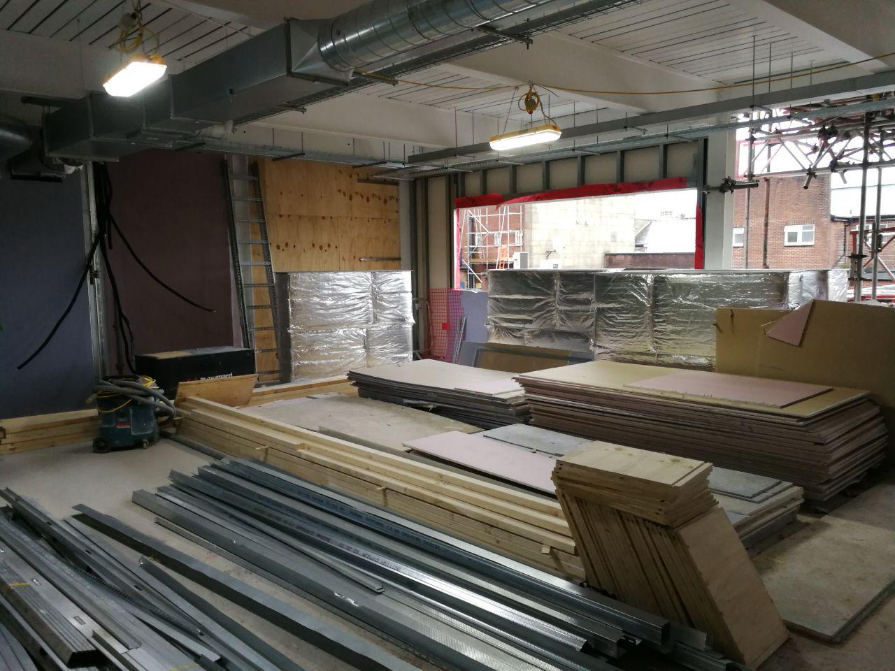 Interior room under construction with materials prepared for installation